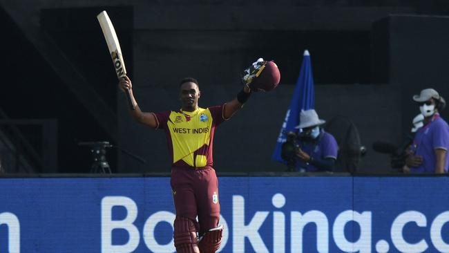 Dwayne Bravo raised his bat as he walked back to the pavilion Picture: AFP