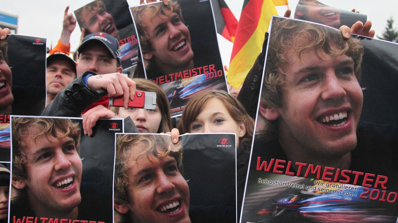 Sebastian Vettel fans hold up placards upon his arrival at his home town Heppenheim after Vettel became the youngest driver to win the Formula One world drivers' championship following his 2010 victory. Picture: Daniel Roland AFP