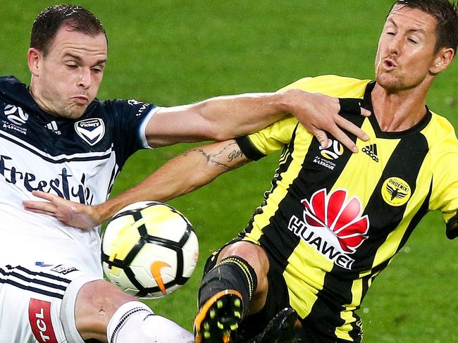 WELLINGTON, NEW ZEALAND - JANUARY 10:  Leigh Broxham of the Victory and Nathan Burns of the Phoenix compete for the ball during the round 15 A-League match between the Wellington Phoenix and Melbourne Victory at Westpac Stadium on January 10, 2018 in Wellington, New Zealand.  (Photo by Hagen Hopkins/Getty Images)