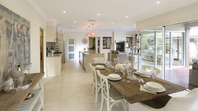 The combined kitchen, meals area and family room opens on to a timber deck and alfresco space.