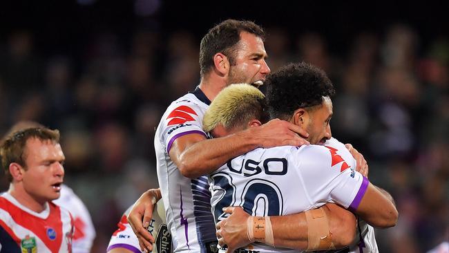 ADELAIDE, AUSTRALIA — JUNE 29: Nelson Asofa-Solomona of the Storm celebrates with his teammates after scoring a try during the round 16 NRL match between the Sydney Roosters and the Melbourne Storm at Adelaide Oval on June 29, 2018 in Adelaide, Australia. (Photo by Daniel Kalisz/Getty Images)