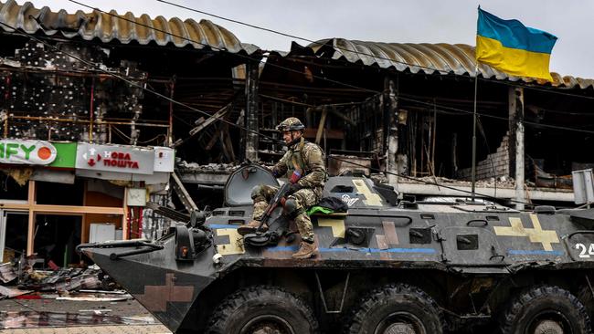 A Ukranian soldier patrols in an armoured vehicle in Bucha, northwest of Kyiv. Picture: AFP