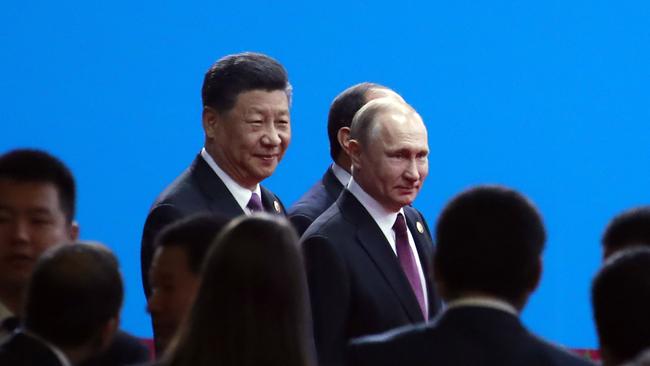 Chinese President Xi Jinping and Russian President Vladimir Putin arrive for the opening ceremony of the second Belt and Road Forum in Beijing. Picture: AP