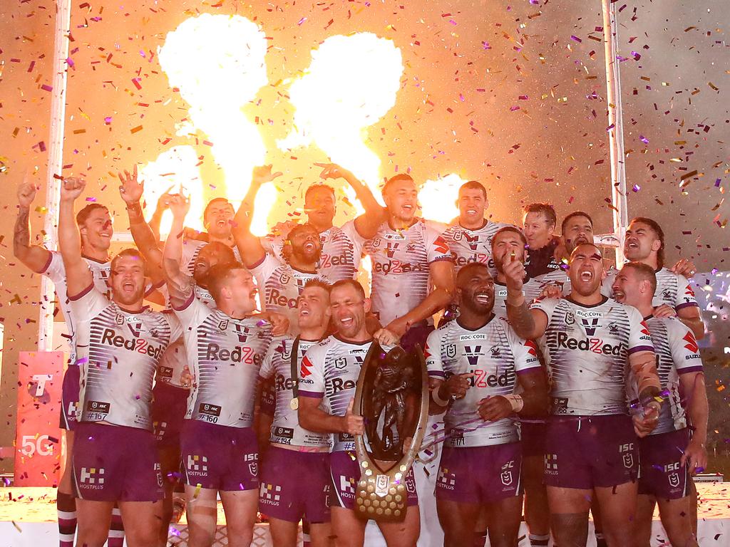 The Melbourne Storm hold up the 2020 NRL trophy. Photo: Cameron Spencer/Getty Images.