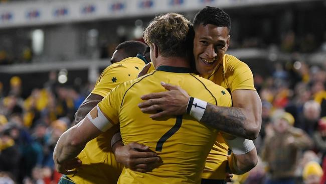 Israel Folau of the Wallabies celebrates with team mates after scoring a try.