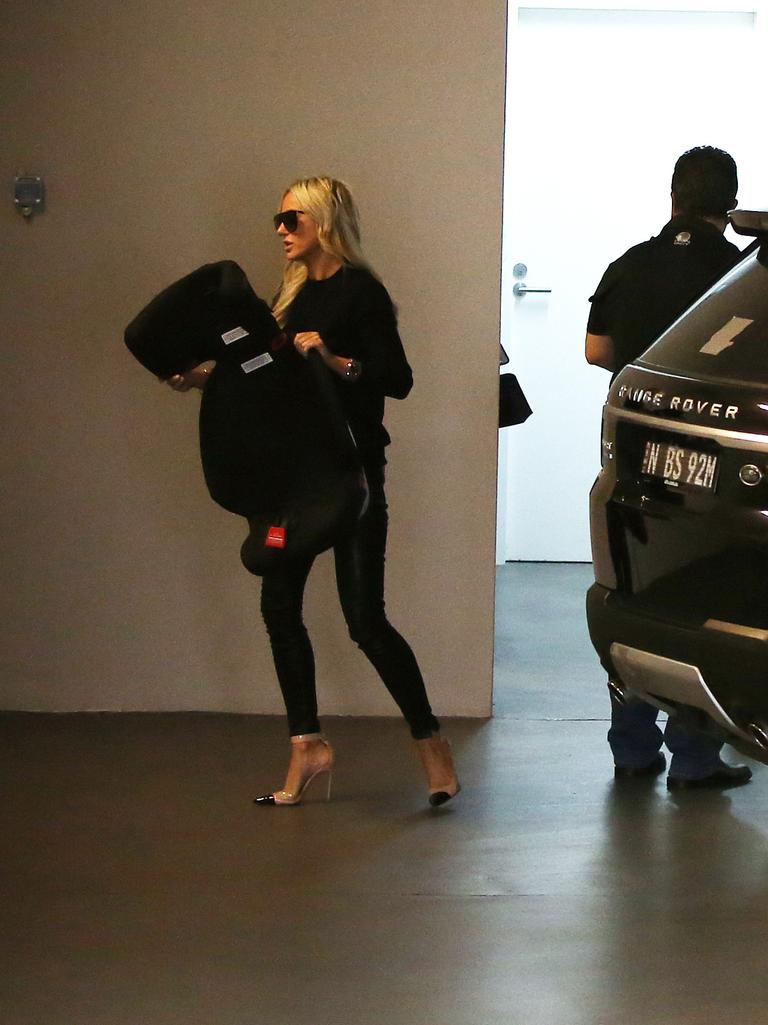 Pictured at their home in North Bondi are Roxy Jacenko and her partner Oliver Curtis arriving home after Olivers release from prison. Picture: Richard Dobson