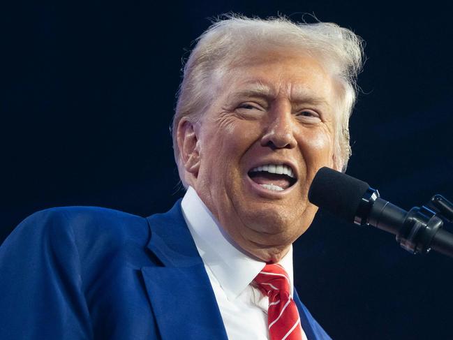 PHOENIX, ARIZONA - DECEMBER 22: U.S. President-elect Donald Trump speaks during Turning Point USA's AmericaFest at the Phoenix Convention Center on December 22, 2024 in Phoenix, Arizona. The annual four day conference geared toward energizing and connecting conservative youth hosts some of the country's leading conservative politicians and activists.   Rebecca Noble/Getty Images/AFP (Photo by Rebecca Noble / GETTY IMAGES NORTH AMERICA / Getty Images via AFP)