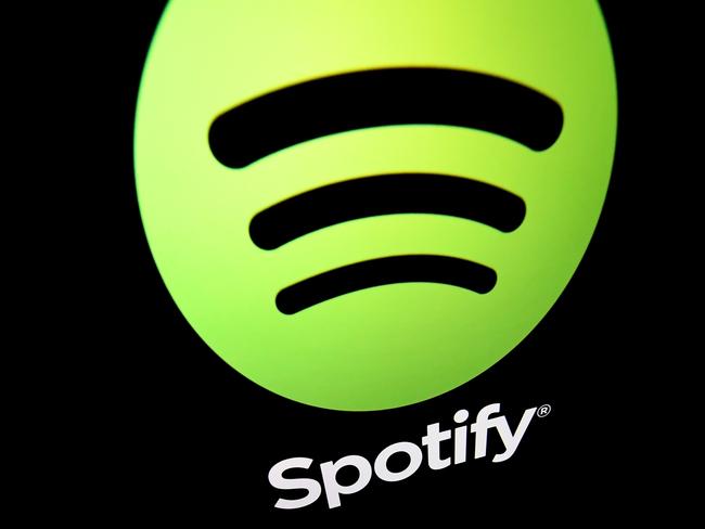 (FILES) This file illustration taken on April 19, 2018 shows the logo of online streaming music service Spotify displayed on a tablet screen in Paris. - Music streaming giant Spotify said Thursday, October 29, 2020 that its number of monthly active users passed the 300-million-mark in third quarter, even as it plunged back into the red. (Photo by Lionel BONAVENTURE / AFP)