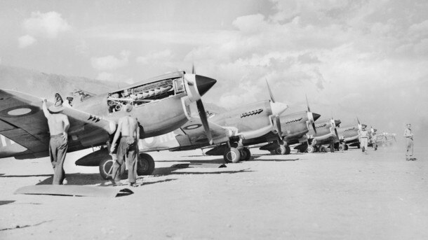 John Jackson’s 75 Squadron flew in Kittyhawks like these, pictured with 78 Squadron. Picture: Australian War Memorial.