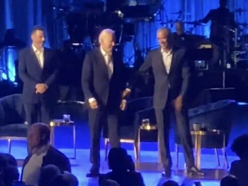 Former President Barack Obama escorts President Joe Biden off stage at the fundraiser in Los Angeles. Picture: X/Twitter