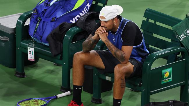 Nick Kyrgios shows his dejection after having to retire (Photo by Clive Brunskill/Getty Images)