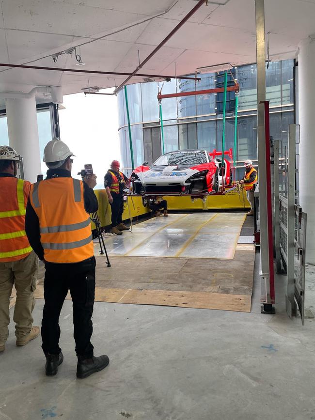 Adrian Portelli got his McLaren Senna GTR 57 lifted by a crane in to his high-rise apartment. Picture: Instagram