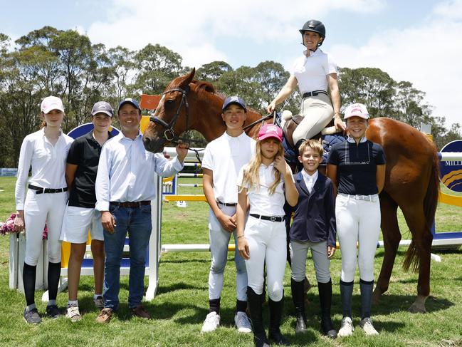 Magic Millions ambassador Ally Mosley, on Gerry, with James Hetherington Magic Millions director of showjumping with junior showjumpers from left Hannah Doolan, Charlie Magnier, Alexander Jang, Iliana Hercus, Rhys McEvoy and Evie Magnier at the Sydney International Equestrian Centre last weekend. Picture: Jonathan Ng