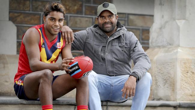 SA AFL draft prospect Kysaiah Pickett, in his State jumper with his uncle Byron Pickett. Picture: AAP Image/Dean Martin