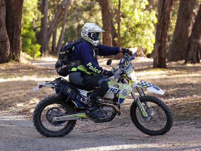 Police on trail bikes join the search. Picture: Ian Currie