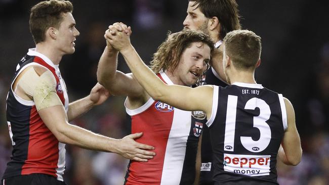 Jack Steven of the Saints (centre) celebrates a goal during the Round 21 AFL match between the St Kilda Saints and the Fremantle Dockers at Marvel Stadium in Melbourne, Sunday, August 11, 2019. (AAP Image/Daniel Pockett) NO ARCHIVING, EDITORIAL USE ONLY