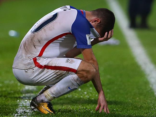 COUVA, TRINIDAD AND TOBAGO - OCTOBER 10: Christian Pulisic of the United States mens national team reacts to their loss to Trinidad and Tobago during the FIFA World Cup Qualifier match between Trinidad and Tobago at the Ato Boldon Stadium on October 10, 2017 in Couva, Trinidad And Tobago.   Ashley Allen/Getty Images/AFP == FOR NEWSPAPERS, INTERNET, TELCOS & TELEVISION USE ONLY ==