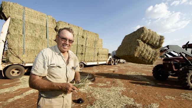 Mixed farmer and chair of the NSW Farmers Association drought taskforce Wayne Dunford in Gunningbland, unloading hay he had to truck in from Victoria. Picture: Graham Schumann