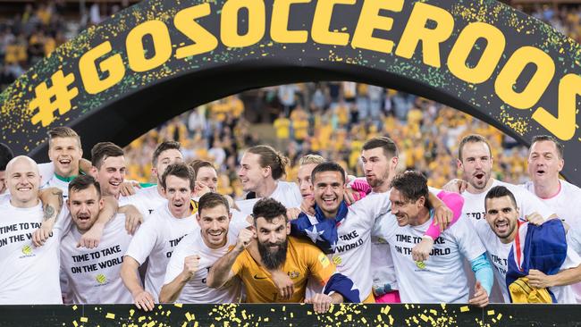 Socceroos players celebrate their playoff win over Honduras that saw them secure their place at next year’s World Cup in Russia.