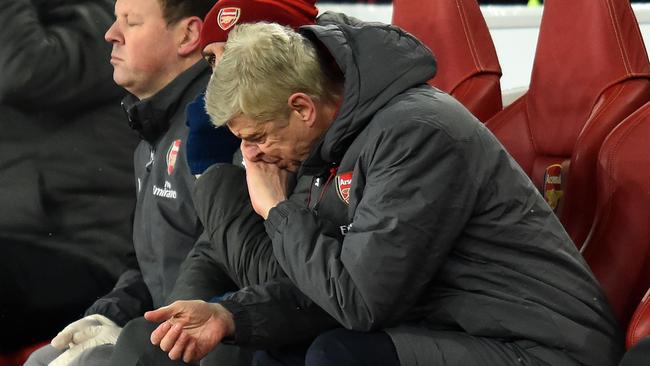 Arsenal's French manager Arsene Wenger reacts in his seat during the English Premier League football match between Arsenal and Manchester City at the Emirates Stadium in London on March 1, 2018. / AFP PHOTO / Glyn KIRK / RESTRICTED TO EDITORIAL USE. No use with unauthorized audio, video, data, fixture lists, club/league logos or 'live' services. Online in-match use limited to 75 images, no video emulation. No use in betting, games or single club/league/player publications. /