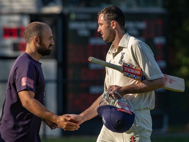 Teammate Nick Ross congratulates Tom Smyth after his innings of 67 not out off 288 balls. Pic: Arj Giese.