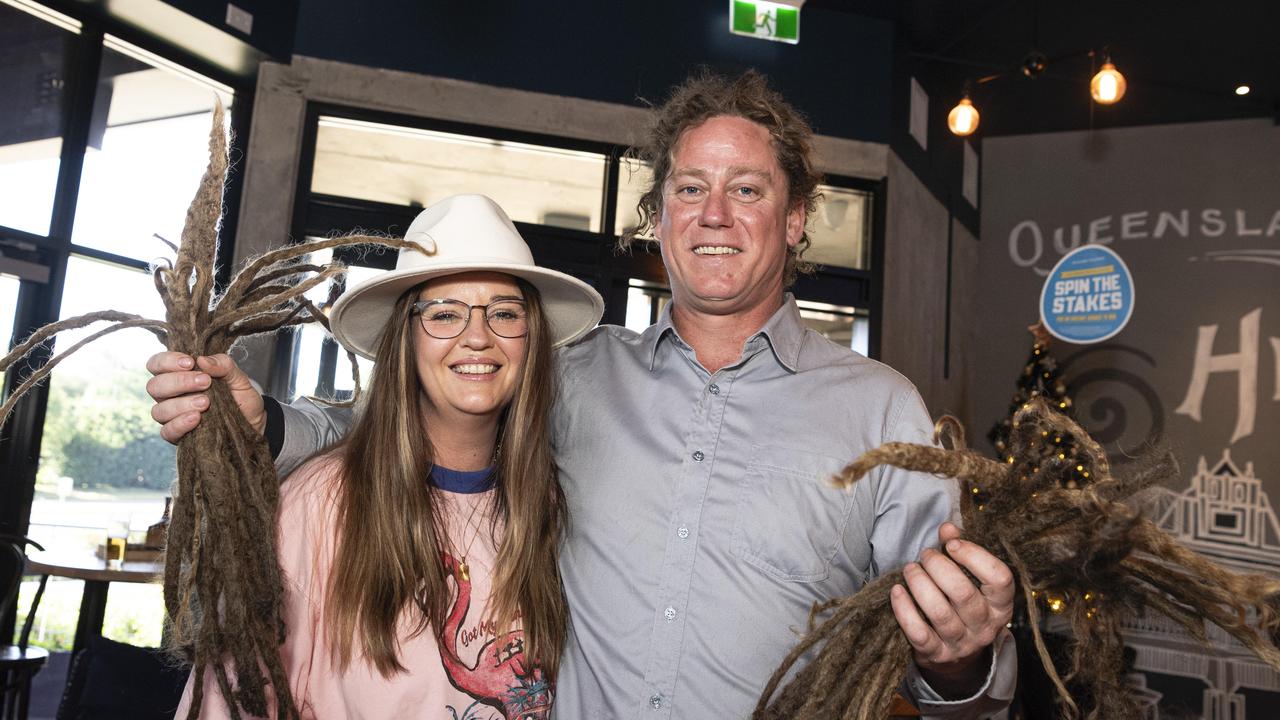 Joel Anderson with wife Shannon Anderson after his dreadlocks are cut off in a fundraiser for their daughter Charlise at the Blue Mountain Hotel, Saturday, November 23, 2024. Picture: Kevin Farmer