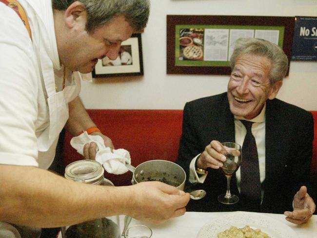 . Chef Sandro Fioriti adds some tobacco sauce to Steve Dunleavy's order of homemade gnocchi in 1993.