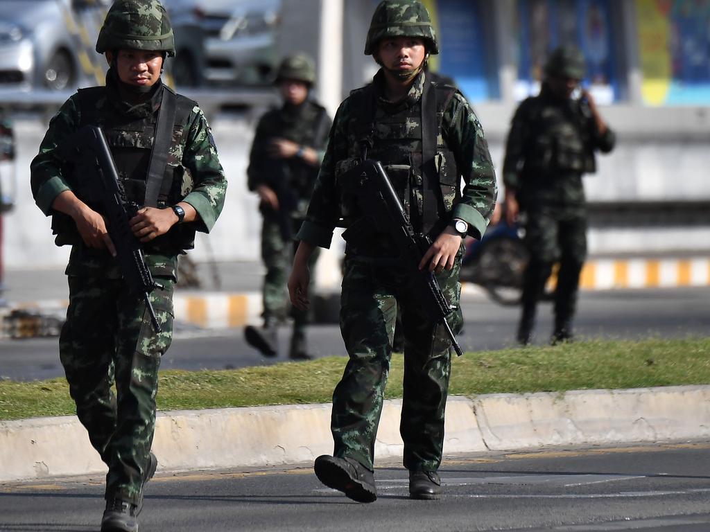 Soldiers walk on the street near the Terminal 21 mall. Picture: AFP