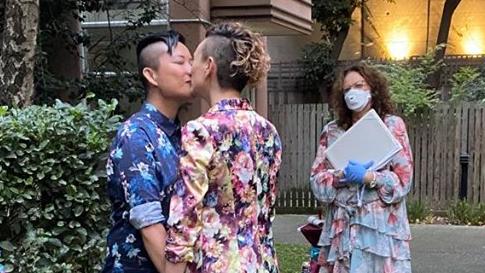 Neighbours cheered from their balconies when Shannen and Allison shared a smooch on their wedding day. Picture: supplied