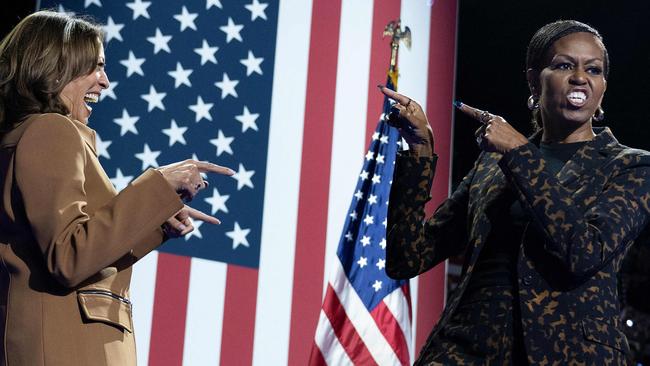 Ms Harris and Mrs Obama at the event in Michigan. Picture: Brendan Smialowski/AFP