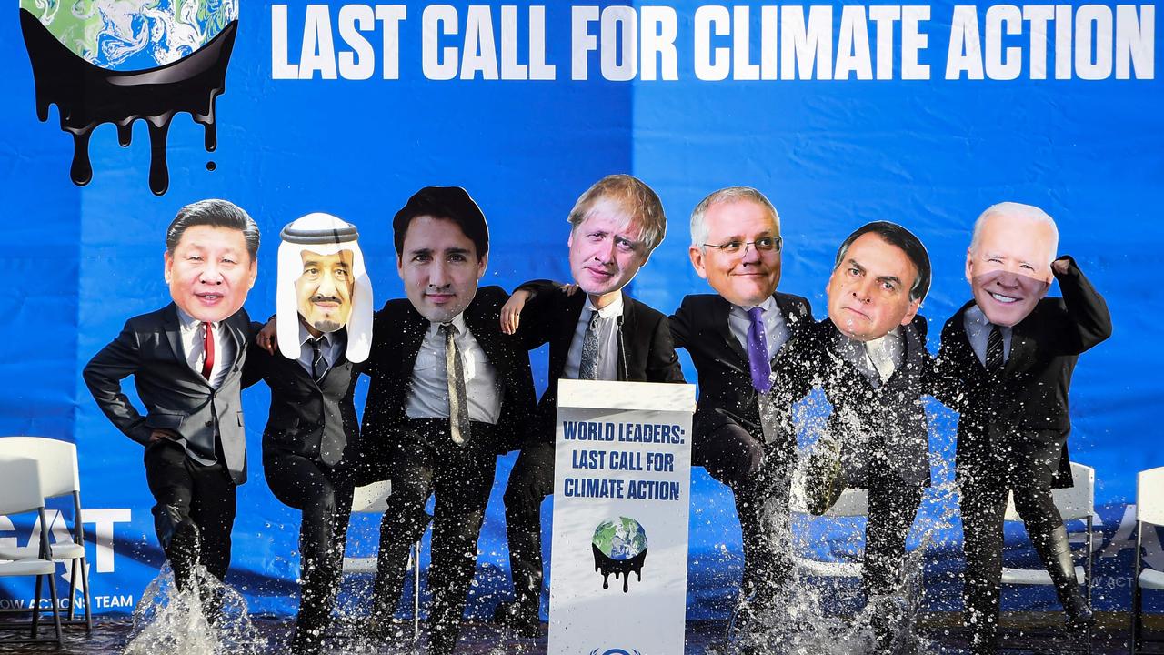 Climate change activists dressed as world leaders, including Scott Morrison (third from right), during a demonstration at the COP26 climate conference in Glasgow. Picture: Andy Buchanan / AFP