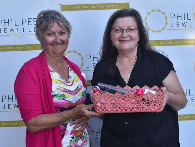 Sharon Coome with BreastScreen Rockhampton clinical director Lea Kleinschmidt at the Rockhampton Jockey Club's Pink Ribbon Stradbroke Charity Race Day at Callaghan Park on June 15, 2024.