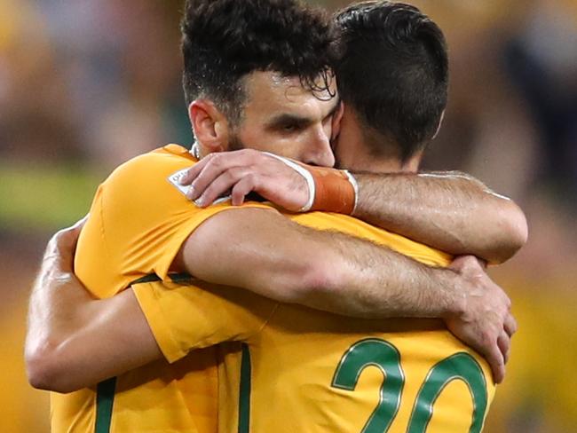 SYDNEY, AUSTRALIA - NOVEMBER 15:  Mile Jedinak and Trent Sainsbury of Australia celebrate victory during the 2018 FIFA World Cup Qualifiers Leg 2 match between the Australian Socceroos and Honduras at ANZ Stadium on November 15, 2017 in Sydney, Australia.  (Photo by Mark Kolbe/Getty Images)