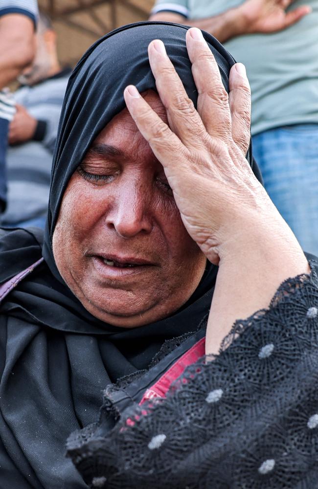 Sabah Said, a Palestinian-Egyptian dual national, reacts as she waits at the Rafah border crossing with Egypt in the southern Gaza Strip. Picture: AFP