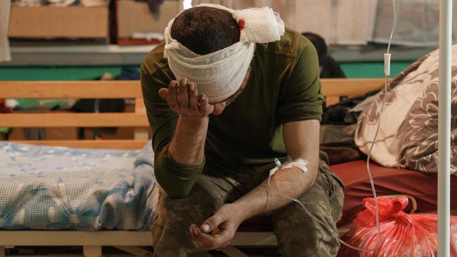 A wounded soldier waits for treatment in a room of the military hospital in Zaporizhzhy amid the Russian invasion of Ukraine. Picture: AFP