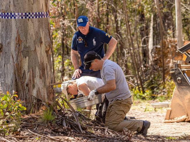 Acting Sgt Florence watching on as police search for evidence.