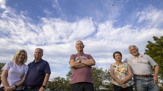 New Farm residents Sue Fuller, Paul Ewart, Fred Ropp, Brownwyn Wright and Geoffrey Warrener at a park under one of the new flight paths. They say noise is now unbearable but BAC’s flight path tool indicated the suburb would not be affected. Picture: Glenn Hunt/The Australian