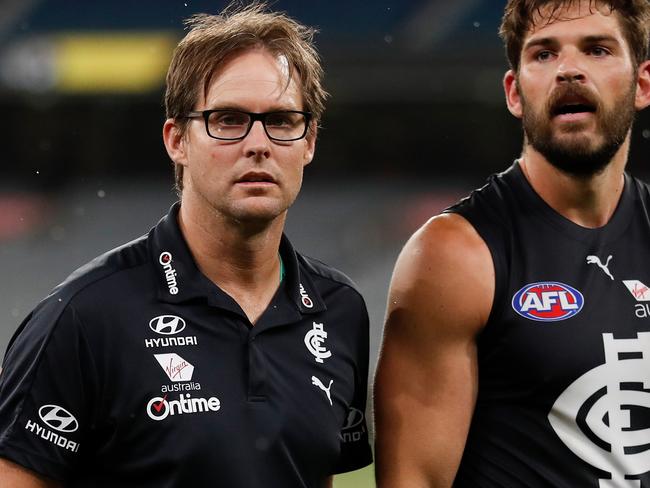 MELBOURNE, AUSTRALIA - MARCH 19: David Teague, Senior Coach of the Blues and Levi Casboult of the Blues look on after the 2020 AFL Round 01 match between the Richmond Tigers and the Carlton Blues at the Melbourne Cricket Ground on March 19, 2020 in Melbourne, Australia. (Photo by Michael Willson/AFL Photos via Getty Images)