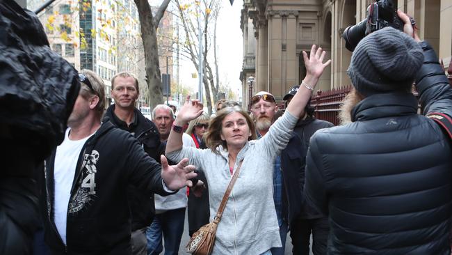 Supporters of Karl Hague clash with media outside the Supreme Court of Victoria in Melbourne, Friday, June 15, 2018. Picture: AAP/David Crosling.