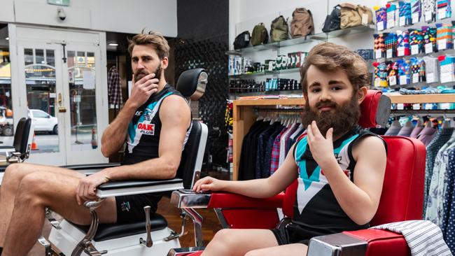 Port Adelaide player Justin Westhoff with Port fan and NAB Mini Legend Koby, 6. Picture: Mackenzie Sweetnam/Getty Images