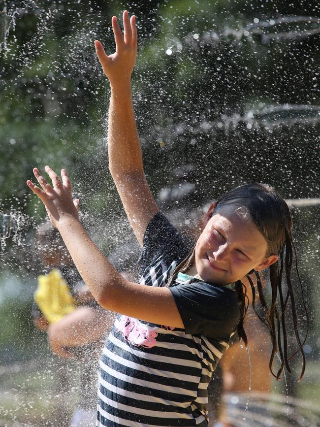 Iris Patten, 9, has fun in the sun at the Curry Reserve Water Play Space at Elderslie. Picture: Robert Pozo