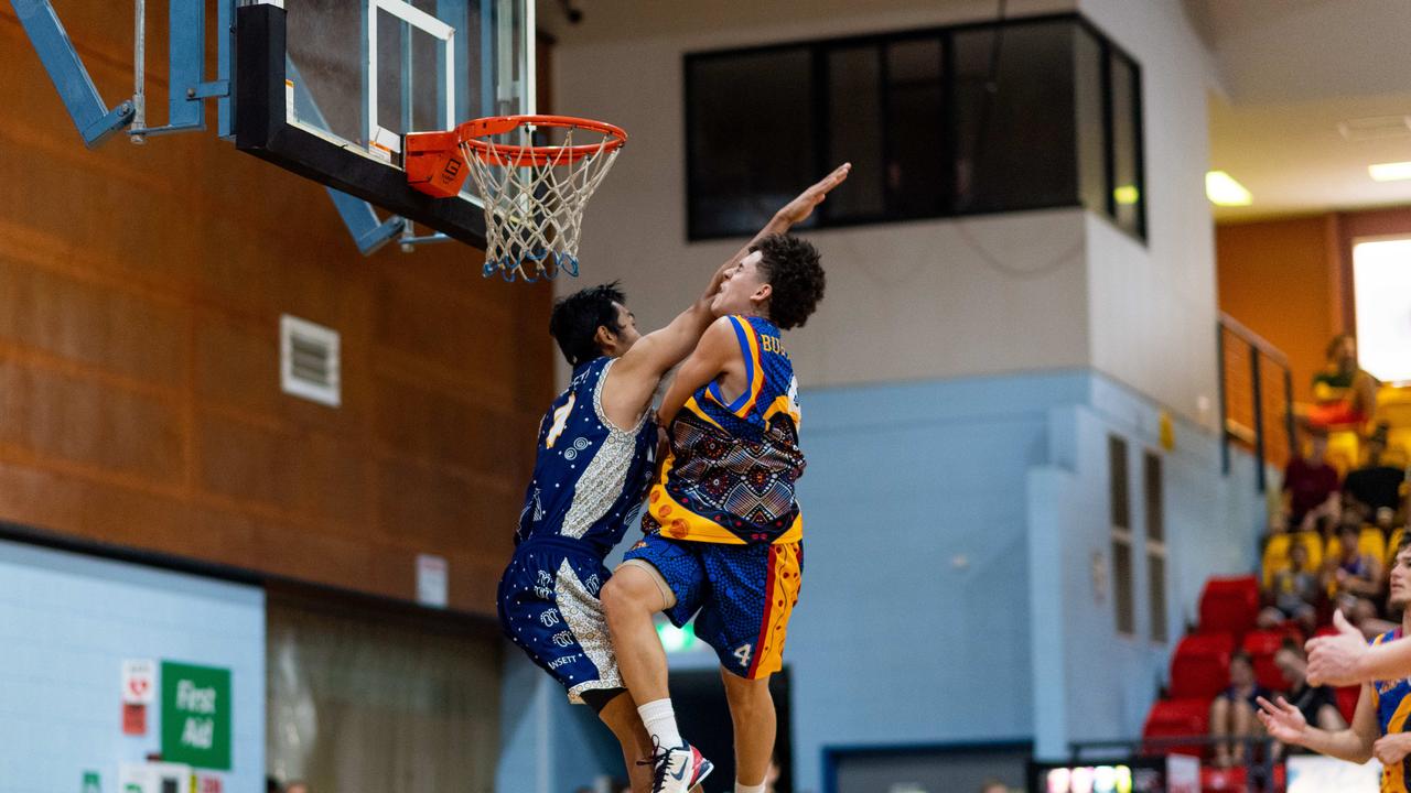 William Burton is fouled heavily by Henry Bui on a drive to the basket. Darwin Basketball Men's Championship Round 20: Ansett v Tracy Village Jets. Picture: Che Chorley