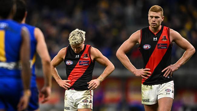 Back to the drawing board: Matt Guelfi and Peter Wright look dejected after their defeat in Perth. Picture: Daniel Carson/AFL Photos via Getty Images