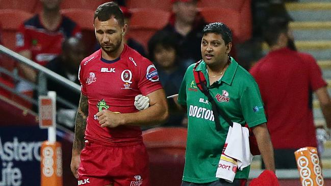 Quade Cooper leaves the field. The Queensland Reds vs the Melbourne Rebels at Suncorp Stadium in Brisbane. Pic Peter Wallis