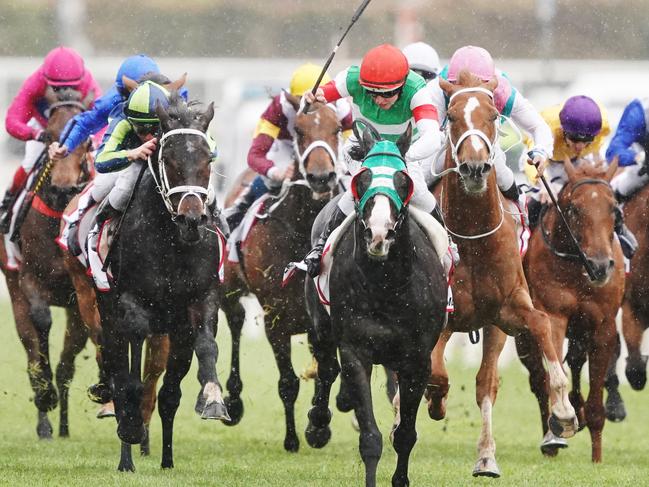 Lane goes for home in the Caulfield Cup aboard the Japanese visitor. Picture: AAP