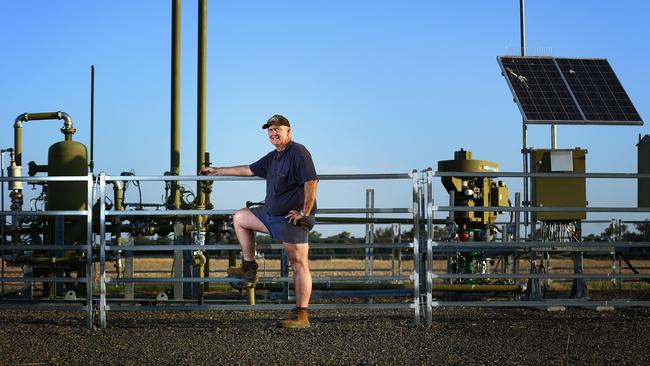 Farmer Peter Gett with one of three Santos coal seam gas pilot wells on his property at Tintsfield outside the town of Narrabri in northwest NSW. Picture: Britta Campion/The Australian