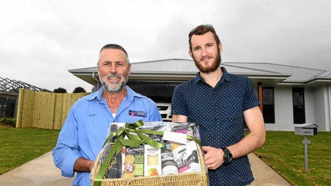 TO THE RESCUE: Builder Scott Sutton and satisfied new home owner Ryan Turner, after Mr Sutton's firm came to the rescue following the collapse of Mr Turner's original builder, Stirling Homes. Picture: Troy Jegers