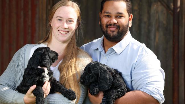 Sarah and Jordan with their puppies Juniper and Willow. Picture: Russell Millard