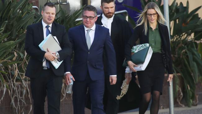 Former SAS soldier Shane Gibbs (centre) arrives at Southport District Court for sentencing. Picture Glenn Hampson.