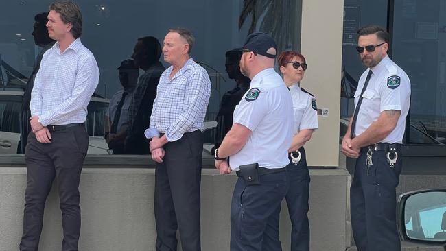 Gregory John McGannon, second from left, with court sheriffs and lawyers during the jury view. Picture: Emma Brasier